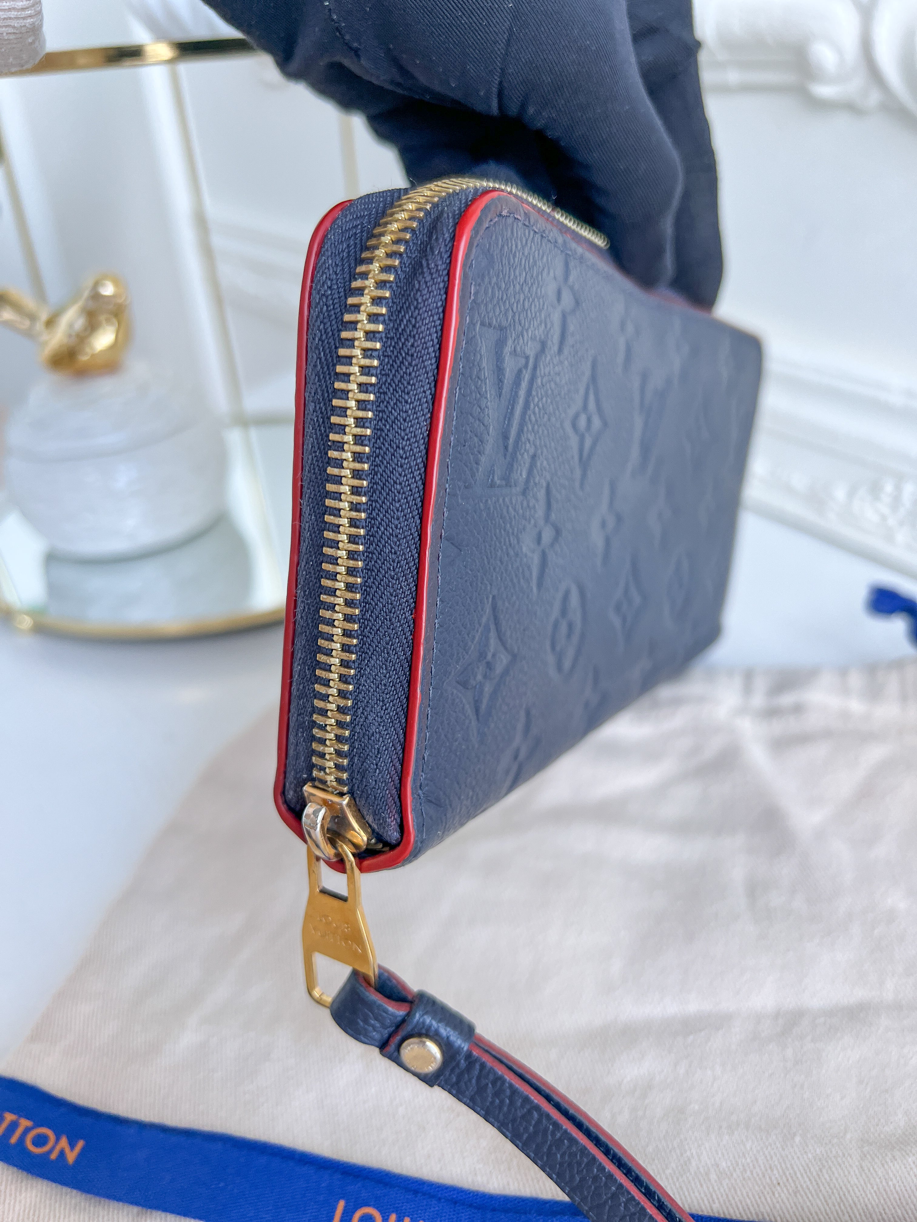LV wallet empreinte dark blue with red