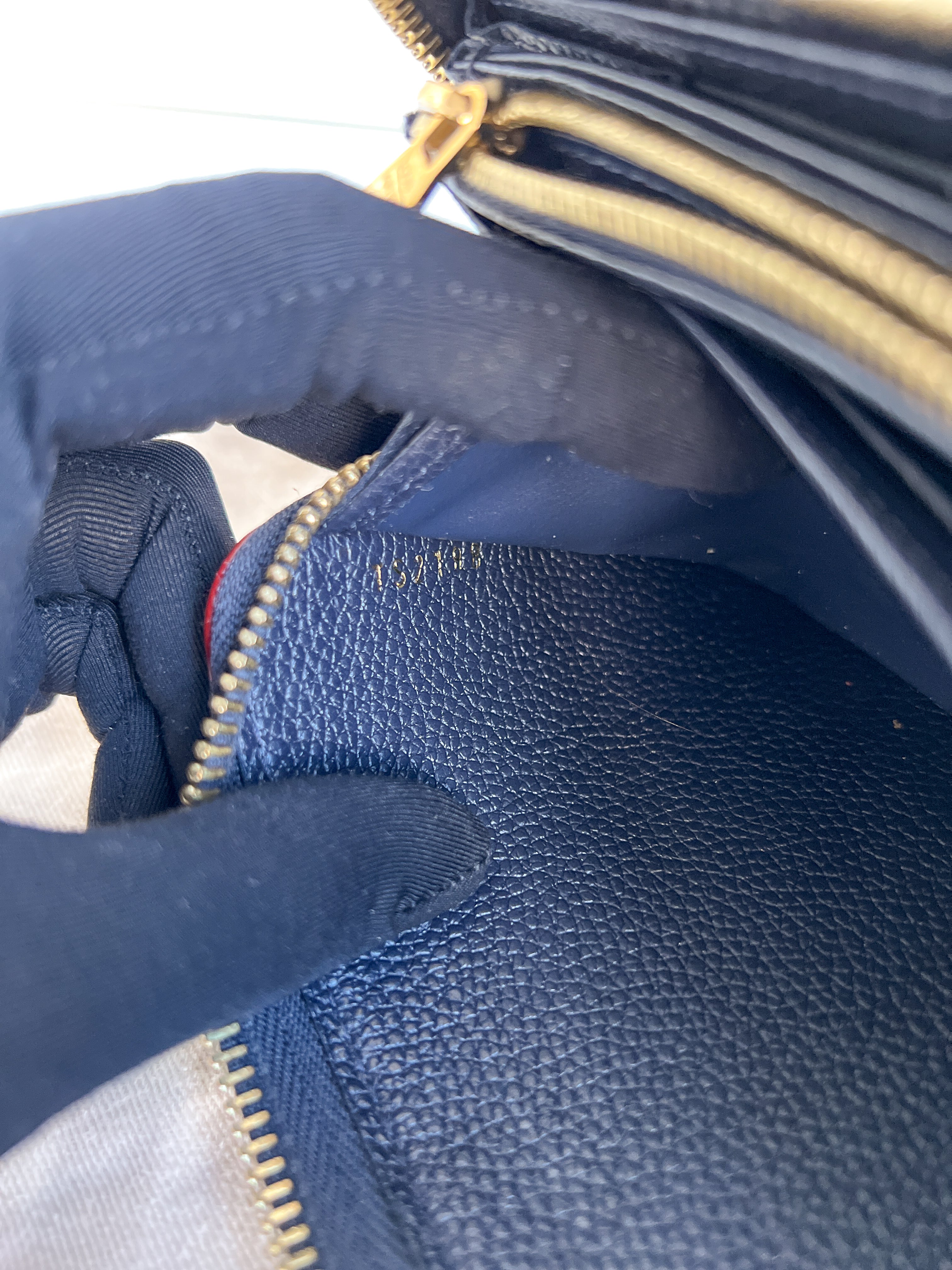LV wallet empreinte dark blue with red