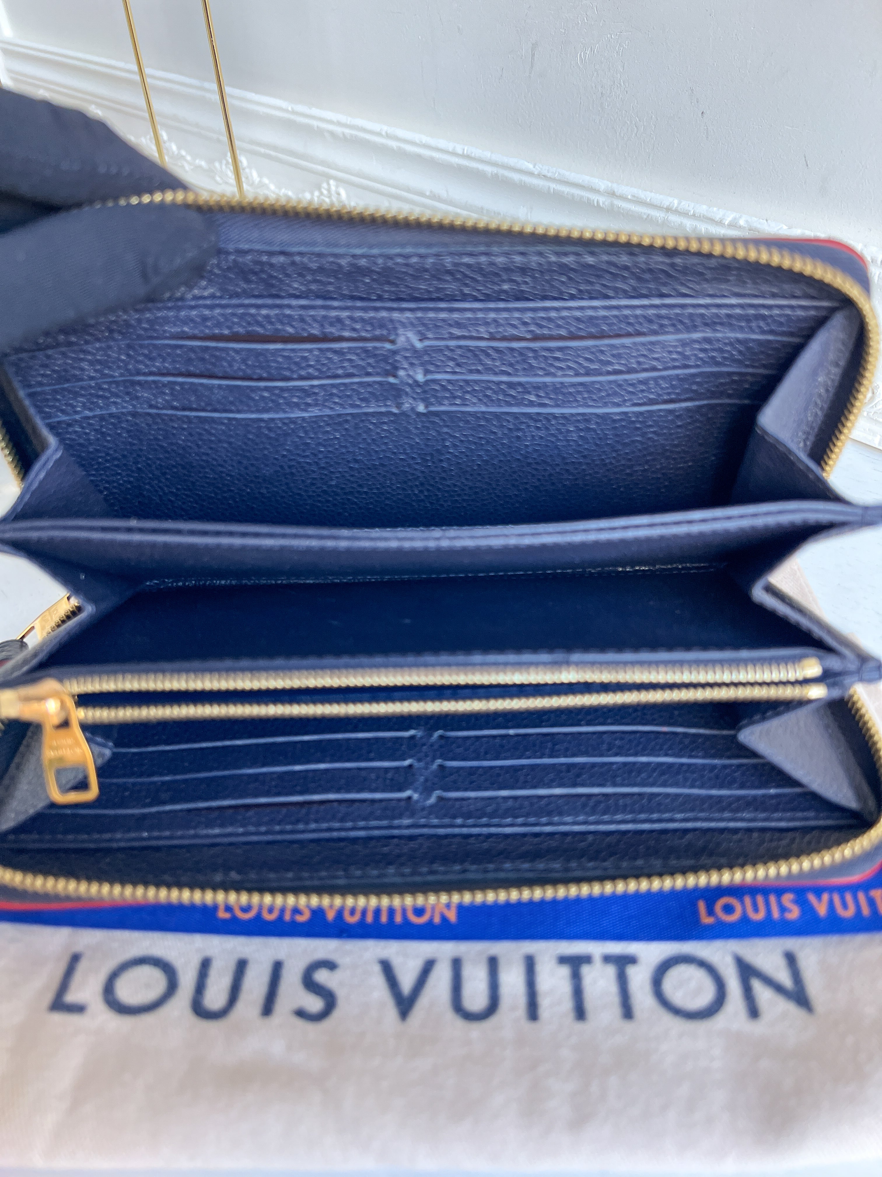 LV wallet empreinte dark blue with red